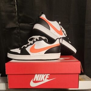 Nike Black and White Shoes with Orange Swoosh